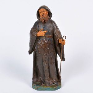 Bela imagem de <b>São Francisco</b>, apresentando hábito negro e um cajado à mão esquerda. Olhos em contas. Fins do séc. XVIII ou início do XIX. Alt. 19,5 cm