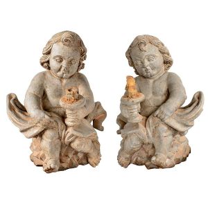 Par de esculturas em pedra esculpidas na forma de anjos com tocheiros às mãos. Séc. XIX. Alt. 50 cm