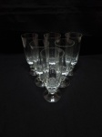 Jogo de 6 taças flutes em cristal com pé disco. Medindo 5,5cm x 15cm de altura.