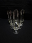 Jogo de 6 taças flutes em cristal incolor. Medindo 4cm x 18cm de altura.