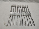 Jogo de 20 garfos de bolo em aço inox Radio. Medindo 16,5cm de comprimento.