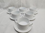 Jogo de 6 xícaras de consume em porcelana Schmidt branca. Medindo 9,5cm x 6cm de altura.