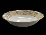 PORCELANA- Bowl em porcelana branca com borda ondulada perolada e decorada com guirlandas de flores em policromia e farta douração. Da manufatura REAL S.PAULO MADE IN BRAZIL.  Medidas 7A X 24D. Em bom estado, com mínimas marcas de uso.