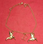 Semi- Joia !! Pulseira foleda a Ouro para criança com pequenos passaros fixos  !! !!   !! 