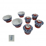 Sete peças  em porcelana japonesa policromada, sendo quatro Yunomi, 4 pites com tampa, 9 x 9 cm. e três bowls 13 x 17 cm.