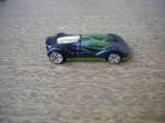 Carro em miiatura - WHEELS 2003 - Em metal, com as rodas em borracha. Cores preta e verde - Diimensões: 7,00 X 3,00 cm - Muito bom para ótimo estado de conservação - Procedência dos Estados Unidos