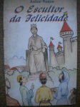 Antigo Livro Infantil - O ESCULTOR DA FELICIDADE - 1ª Edição - Ano 1995 - Autor Aníbal Roque - Sem informação de editora - Formato 14,00 X 21,00 cm - BROCHURA <<<<<< Livro em bom estado de conservação, contendo 34 páginas.
