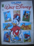 Álbum de Figurinhas - GALERIA WALT DISNEY - Sem data - Editora Abril - Formato 20,5 X 27,5 cm <<<< COMPLETO >>>> O miolo está em ótimo estado de conservação. A capa está em bom para muito bom estado, om pequena marca de dobra na ponta inferior, junto a borda direita. Pequeno corte na ponta inferior na lombada, sem perda.