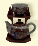 Miniatura oriental de bule e xícara.