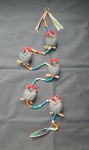 Antigo móbile decorativo, com pequenas galinhas de tecido estampado, intercaladas com contas e tubos plásticos multicoloridos - Comprimento: 120 cm - Galinhas: 6 cm