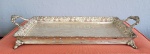 Bandeja em prata de lei retangular com galeria fenestrada, testada. Med.: 36x22cm. 985 gramas.