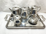 Jogo de servir chá, café com 6 peças em aço inox Meridional. Composto de 2 bules, leiteira, manteigueira, açucareiro e bandeja.