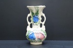 Vaso ornamental em faiança, moldado na pasta, ornado com flores e folhagens em rica policromia. Alças vazadas, alguns motivos á ouro folha. Marcas do tempo. Alt. 25 cm.