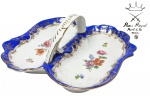 PARIS ROYAL - Rara e belíssima petisqueira cesta, feita em porcelana de ótima qualidade e manufatura, adornada por lindo trabalho pintado á mão com motivo floral e ricos filetes á ouro. Perfeito estado de conservação, mede 8 cm de altura x 20 x 18 cm da borda.