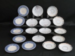 Dezoito pires para café em porcelana sendo; seis com frisos dourados manufatura Steatita, seis com florais e seis com gregas em azul manufatura oxford.