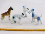 JAPAN -VINTAGE- Quatro (04) miniaturas em porcelana japonesa policromada representando " Cães", década 60. Med. maior 5,5 cm.