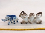JAPAN -VINTAGE- Três (03) miniaturas em porcelana japonesa policromada representando " Um elefante e conjunto de trio de macacos, Mizaru, Kikazaru e Lwazaru", década 60. Med. Conjunto de macacos 9 cm comprimento.