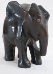 Escultura em ébano representando " Elefante" símbolo da Boa Sorte com entalhes e aplicações em marfim, séc XIX. Faltam as presas. Med. 14,5 cm alt.