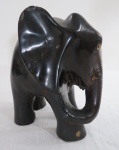 Escultura em ébano representando " Elefante" símbolo da Boa Sorte com entalhes e aplicações em marfim, séc XIX. Faltam as presas. Med. 15 cm alt.