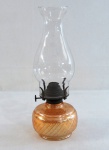 Antigo lampião a querosene, base em vidro " Carnival Glass", manga em vidro translúcido, borda ondulada. Med. 29 x 10 cm.