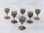 JAPAN- Seis (06) cálices em vidro com estrutura em metal prateado com decoração em guirlandas. Marcado. Med. 10 cm alt.