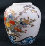 Vaso bojudo japonês na cor branca, decorado floral no tom azul, bojo com arbustos e aves do paraíso, policromado e vitrificado selado na base. Med. 11 cm alt x 10 cm. Selado na base SHIBATA-JAPAN.