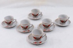 Seis (06) xícaras para café em porcelana branca decoradas com flores e frisos dourados.