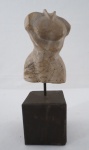 Escultura em pedra representando " Torso Feminino", base cúbica em madeira. Med. 31 x 10 x 10 cm.