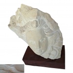 Mestre Nicola - Pernambuco, Sec. XX, Cabeça de Anjo, Escultório em calcário apoiado em base de madeira, assinado e datado 2000, Alt. 25, Base, 21 x 10, Alt. 5 cm.