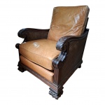 Poltrona executada em Jacarandá, sec. XIX com molduras e braços vazados por dupla palhinha indiana, encosto também em palhinha, íntegras, estofamento removível, fechamento em fecho [éclair e em couro bovino na cor caramelo, braços  adornados com folhagens, pernas em garra de animal,  apresenta insignificante marca de uso no couro e braços,77 x 77, Alt. 100 cm.