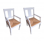 Par de cadeiras de braço em madeira nobre patinadas de branco, assento em taboa,  apresentam  leves falhas na pátina. 52 x 51, Alt. 103 cm.