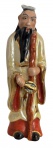 Escultura em porcelana oriental policromada vitrificada,, 'figura de ancião com cajado". Possui numeração na base. Mede 20cm.