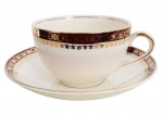 INGLATERRA - Xícara para chá e ou coleção em porcelana inglesa esmaltada na cor creme, adornada com guirlandas em vibrante ouro sobre fundo magenta. Período 1900. Possui registro da manufatura ALFRED MEAKI ENGLAND. Acompanha o seu respectivo pires.