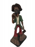 Escultura em terracota policromada, figura masculina "lenhador" portando madeira e machado. Assinada na base. Altura 50cm x 26cm largura.