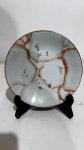 PRATO DE PORCELANA ORIENTAL medindo15 cm de diâmetro