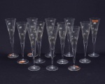 NATCHMANN - conjunto de 12 taças para flute,  de cristal incolor com decoração stars in gold. Base com marca d'gua Natchmann. 24,5 cm altura