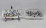 Duas salvas retangulares em porcelana holandesa na cor branca, fundo decorada com "Comedores de peixe" e "Ciclistas" pintados a mão. Marcado GOUDA - HOLLAND. Med. 23 x 11 cm.