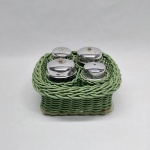 Galheteiro em plástico verde, vidro e acrílico, tampas em metal prateado. Cesto, paliteiro, saleiro e recipientes para azeite e vinagre. Med. 10 x 19 x 19 cm.
