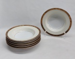 NORITAKE - Seis pratos fundos em porcelana japonesa decorada com faixa creme, borda em ouro brunhido e canetado em preto com flores e folhagens. Marca da Manufatura no fundo. Diam. 20cm.