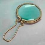 COLECIONISMO - Grande Lupa em metal espessurado a prata. Med. 25x13 cm.