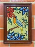 QUADRO - Tapeçaria emoldurada, bordada à mão, com um motivo de pássaro e flores. Med. 65x46 cm.