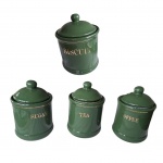 Quatro de potes em cerâmica na cor verde com letras e cinturão dourado, Sugar, Tea, Coffee,  Biscuit fechamento hermético, em sua embalagem original, nunca foram usados, Alt.22, 15, Diam. 10 e 15 cm.
