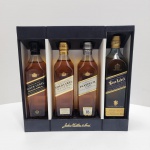 JOHNNIE WALKER  COLLECTION SETBlack Label 12 anos  Gold Label Reserve  Platinum Label 18 anos  Blue Label4 garrafas  200 ml cada Conjunto oficial Johnnie Walker Collection, apresentado em estojo rígido original com acabamento em preto fosco, detalhes metalizados e indicação das quatro garrafas. O interior contém :Johnnie Walker Black Label  12 Years Old  200 mlBlended Scotch Whisky clássico, reconhecido mundialmente .Johnnie Walker Gold Label Reserve  200 ml Blend premium, com perfil suave e melado. Johnnie Walker Platinum Label  18 Years Old  200 ml Versão superior, envelhecida 18 anos, hoje descontinuada nesta nomenclatura. Johnnie Walker Blue Label  200 ml Expressão de luxo da marca, produzida em pequenos lotes.