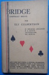 Livro Bridge (Contract Bridge), por Ely Culbertson - "O melhor jogador e a maior autoridade no Mundo. Este Livro que ensina o systema exposto pelo proprio autor,é um compendio completo e oficial de como declarar, abonar, sahir e cartear, enfimde como jogar o bridge com facilidade". Obra em bom estado de conservação, mantendo suas capas editoriais, 150 páginas.