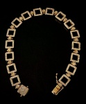 Pulseira Grife Carla Amorim em ouro rosé 750, cravejada com diamantes, 17 cm, pesando 15,31g.