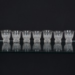 VIDRO, sete (7) copos, incolores e translúcidos, modelados em gomos, marca CRYSTOLAC REGO BRITISHTOUGHENED, medindo 7,5 cm diâmetro e altura, sinais de uso, vide foto.