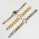 RELÓGIOS, três (3) diversos, todos movimento quartz: 1 da marca GUESS (loja de roupas e acessórios, fundadaem 1981 pelos irmãos Georges; Maurice; Paul e Armand Marciano, em Los Angeles, Califórnia, USA), caixa e pulseiraem metal prateado detalhes dourado, medindo 21 mm diâmetro; 1 da marca CATINET, mostrador preto com algarismosarábicos, caixa e pulseira em aço, detalhes dourado, medindo 37 x 22 mm; 1 da marca OK, mostrador branco,algarismos arábicos, caixa e pulseira em metal dourado, medindo 23 mm diâmetro, todos usados, não testados e semgarantia, possivelmente demandam bateria, vide foto.
