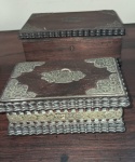 Conjunto com duas caixas porta joias em  jacarandá canelado decorado com placas em prata a menor tem bandeja com Divisórias.