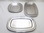 Jogo de 3 travessas em aço inox Wolff. Medindo a retangular maior 32,5cm x 20cm.