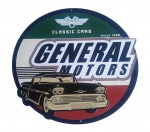 Placa decorativa em metal "eneral Motors". Medida 42 cm de diâmetro.